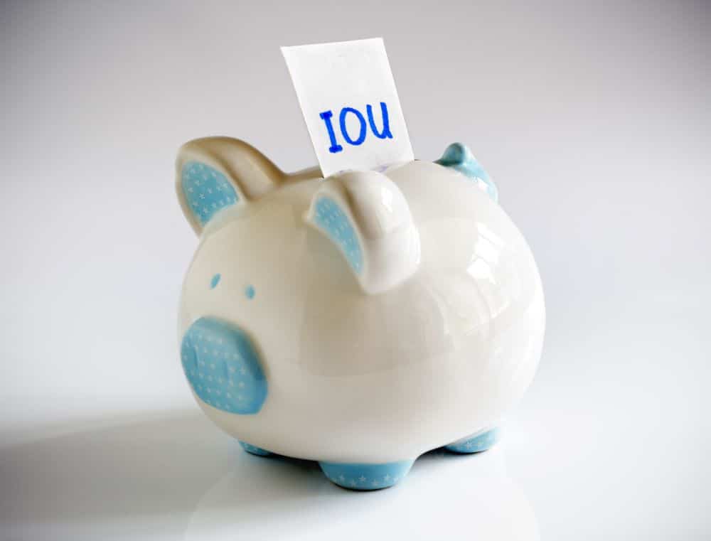 A piggy bank with an IOU statement, serving as a reminder of all the times you tried to lend yourself money.